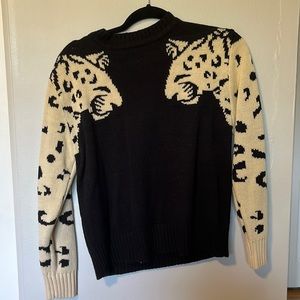 Black sweater with animal design